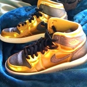 Jordans metallic gold black and white